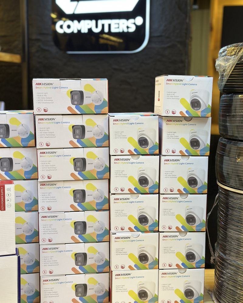 Stacks of boxed Hikvision cameras in the shop
